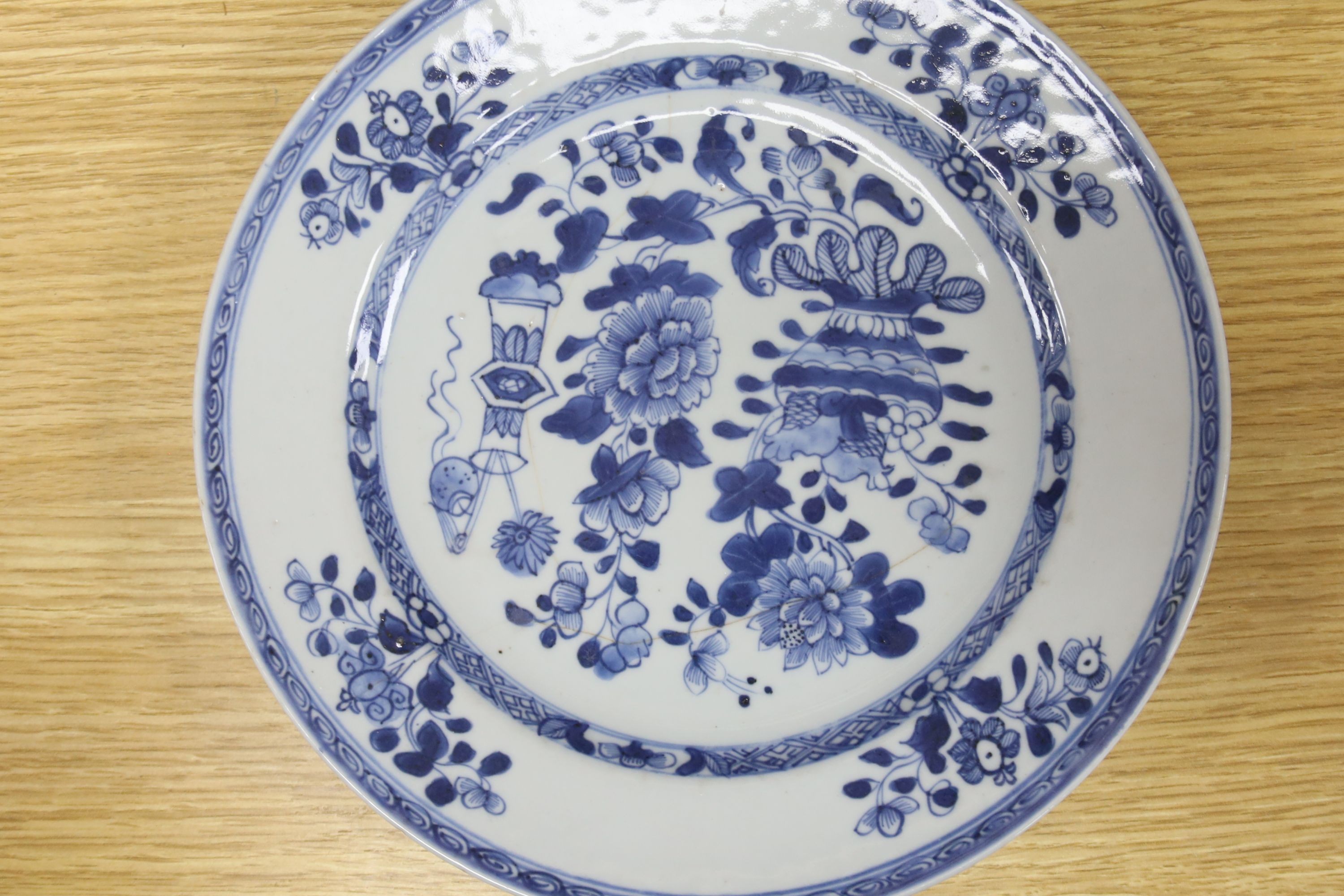 Six 18th century Chinese Export blue and white dishes with floral decoration and five matching plates, Dia 23cm
